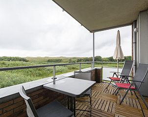 Balcony overlooking nature at Duinerei C103 Groote Keeten vacation home in Callantsoog, North Holland.