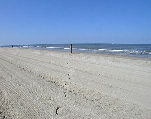 Vast sandy beach at Duinerei C103 Groote Keeten vacation home in Callantsoog, North Holland.