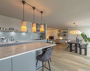 Kitchen and dining area in Beach Life 006 Groote Keeten, Callantsoog, with contemporary decor.