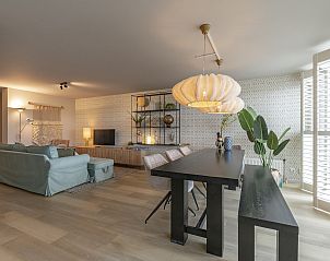 Cozy dining room of Strandleven 006 Groote Keeten, Callantsoog, with modern decoration.