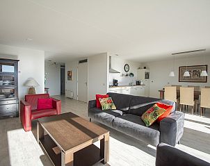 Open kitchen and dining area in Strandleven 103 Groote Keeten vacation home in Callantsoog, North Holland.