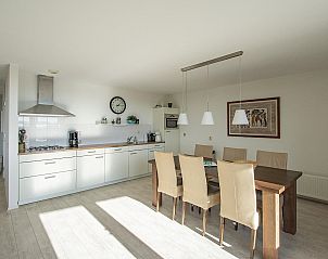 Dining room and kitchen in Beach Life 103 Groote Keeten vacation home, Callantsoog on the North Sea coast.