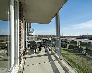 Spacious balcony of Strandleven 103 Groote Keeten vacation home in Callantsoog with beautiful view.