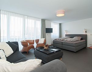 Spacious bedroom in Suite Duinzicht Callantsoog with comfortable beds, North Sea coast, North Holland.