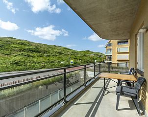 Spacious balcony overlooking the dunes at Wijde Blick 112 Callantsoog, vacation home on the North Sea coast.