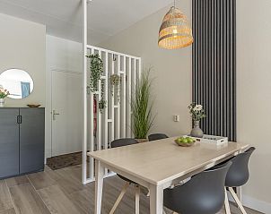 Cozy dining area in Wijde Blick 112 Callantsoog, vacation home on the North Sea coast, North Holland.
