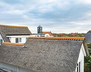 Views of thatched roofs from Wijde Blick 203, vacation home in Callantsoog, North Holland.