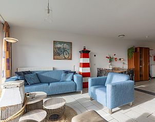 Stylish living room of vacation home Wijde Blick 205 Callantsoog, perfect for relaxation on the North Sea coast.