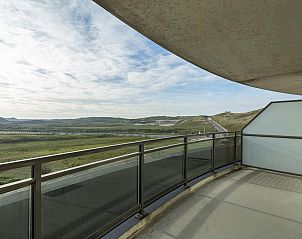 Expansive view from balcony of Wijde Blick 205 Callantsoog, serene setting on the North Sea coast.