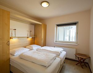 Attractive bedroom in Wijde Blick 301 Callantsoog vacation home on the North Sea coast in North Holland.