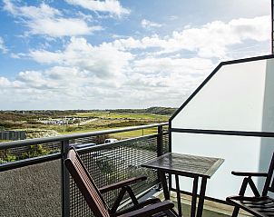 Balcony overlooking nature from Wijde Blick 301 Callantsoog vacation home on the North Sea coast in North Holland.