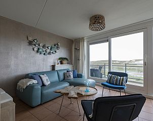 Living room with view in Wijde Blick 307 Callantsoog, vacation home on the North Sea coast, North Holland.
