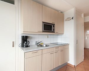 Modern kitchen in Wijde Blick 307 Callantsoog, vacation home in Callantsoog, North Holland.