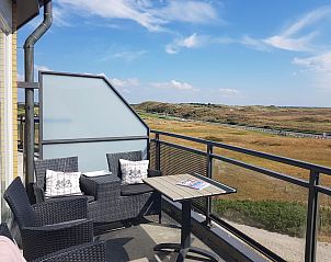 Terrace overlooking the dunes at Wijde Blick 307 Callantsoog, vacation home in North Holland.