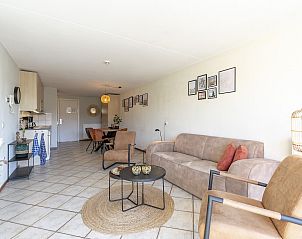 Spacious open living room and kitchen in Wijde Blick 309 Callantsoog, vacation home on the North Sea coast in North Holland.