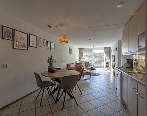 Dining and sitting area in Wijde Blick 309 Callantsoog, vacation home on the North Sea coast in North Holland.