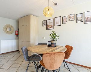 Sunny living room overlooking dunes in Wijde Blick 309 Callantsoog, vacation home on the North Sea coast in North Holland.