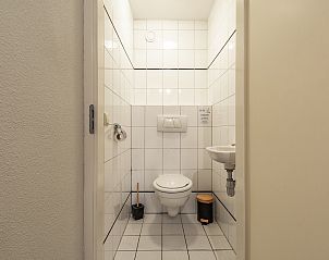 Terrace overlooking the dunes at Wijde Blick 309 Callantsoog, vacation home on the North Sea coast in North Holland.