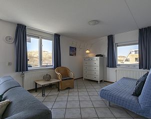 Comfortable sitting area in Wijde Blick 311 Callantsoog, vacation home on the North Sea coast in North Holland.
