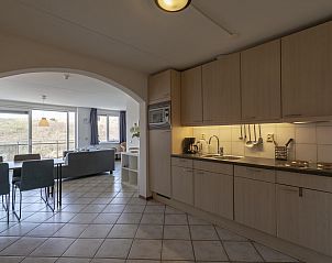 Kitchen and living room in Wijde Blick 311 Callantsoog, vacation home in Callantsoog, North Holland.