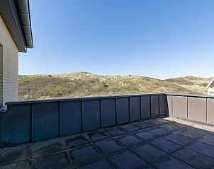 Terrace with dune view at Wijde Blick 311 Callantsoog, vacation home on the North Sea coast in North Holland.