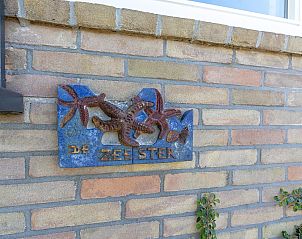 Decorative facade stone of Previnaireweg 34 Callantsoog vacation home on the North Sea coast.