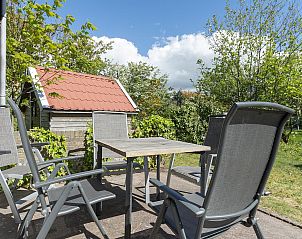 Seating area on the terrace of Previnaireweg 34 Callantsoog vacation home in North Holland.