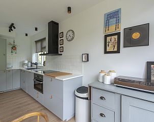 Stylish kitchen of Previnaireweg 34 Callantsoog vacation home with modern appliances.