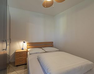 Bedroom with double bed in Wijde Blick 208 Callantsoog, vacation home on the North Sea coast.