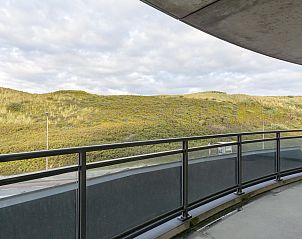 Balcony overlooking dunes at Wijde Blick 208 Callantsoog, vacation home on the North Sea coast.