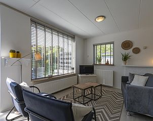 Bright living room overlooking garden at Effe Sprage Callantsoog in Callantsoog.