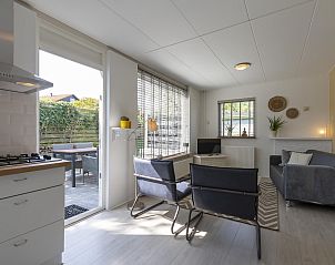 Sunny living room with kitchen in Effe Sprage Callantsoog vacation home, Callantsoog.