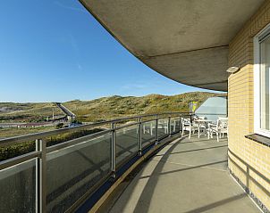 Spacious balcony of vacation home Wijde Blick 206 Callantsoog overlooking the dunes on the North Sea coast.