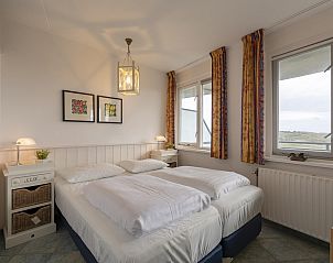 Attractive bedroom in Wijde Blick 206 Callantsoog, vacation home on the North Sea coast, overlooking the dunes.