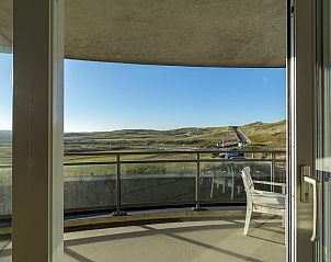 View from balcony of Wijde Blick 206 Callantsoog, vacation home on the North Sea coast, over dunes.