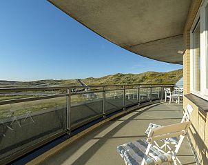 Spacious balcony of Wijde Blick 206 Callantsoog, vacation home on the North Sea coast, perfect for outdoor breakfasts.