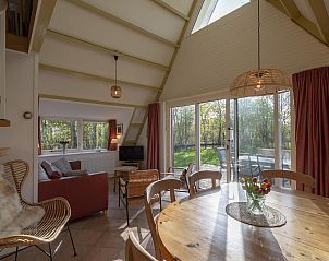 Bright dining room in Sandepark 093 Groote Keeten vacation home in Callantsoog, North Holland.