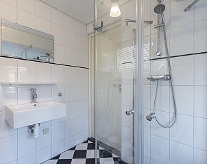 Modern bathroom in Sandepark 093 Groote Keeten vacation home in Callantsoog, North Holland.