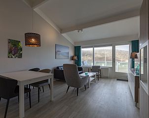 Spacious living room in Beach Apartment 35 Callantsoog with lots of natural light.