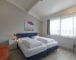 Comfortable bedroom with large windows in Beach Apartment 35 Callantsoog.