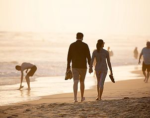 Romantic beach walk at sunset, near The Bunker Callantsoog, North Sea coast, North Holland.