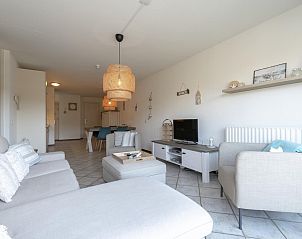 Bright and spacious living room in vacation home Wijde Blick 212 Callantsoog, North Holland.