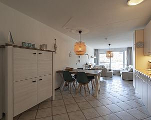 Cozy kitchen and dining room in vacation home Wijde Blick 212 Callantsoog, North Holland.