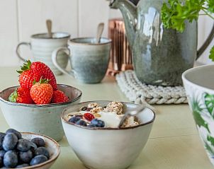 Healthy breakfast with fresh fruit at Holiday Home in Callantsoog, North Sea Coast, North Holland for an energetic start to the day.