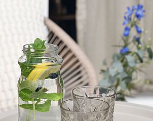 Inviting terrace with seating area in Holiday home in Callantsoog, North Sea coast, North Holland for relaxing moments.