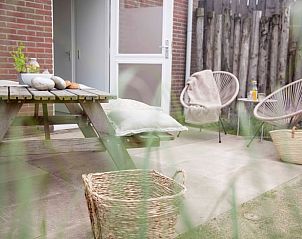 Flowering garden at Holiday home in Callantsoog, North Sea coast, North Holland with colorful flowers and natural beauty.