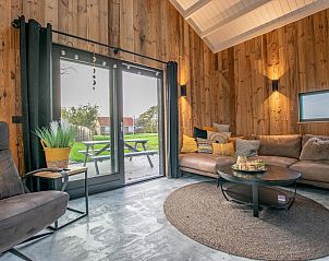 Spacious sitting area in Spoiled Wheel vacation home, Callantsoog overlooking the garden.