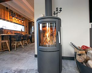 Wood stove in Spoelde wheel vacation home in Callantsoog for a warm and cozy atmosphere.