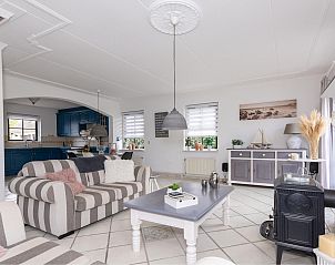 Cozy living room in the Detached house in Callantsoog, North Sea coast, North Holland, with comfortable seating area and modern furnishings.