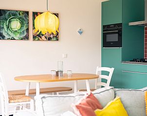 Dining area in Royal Dune 4, Callantsoog, with unique decoration and modern kitchen facilities.